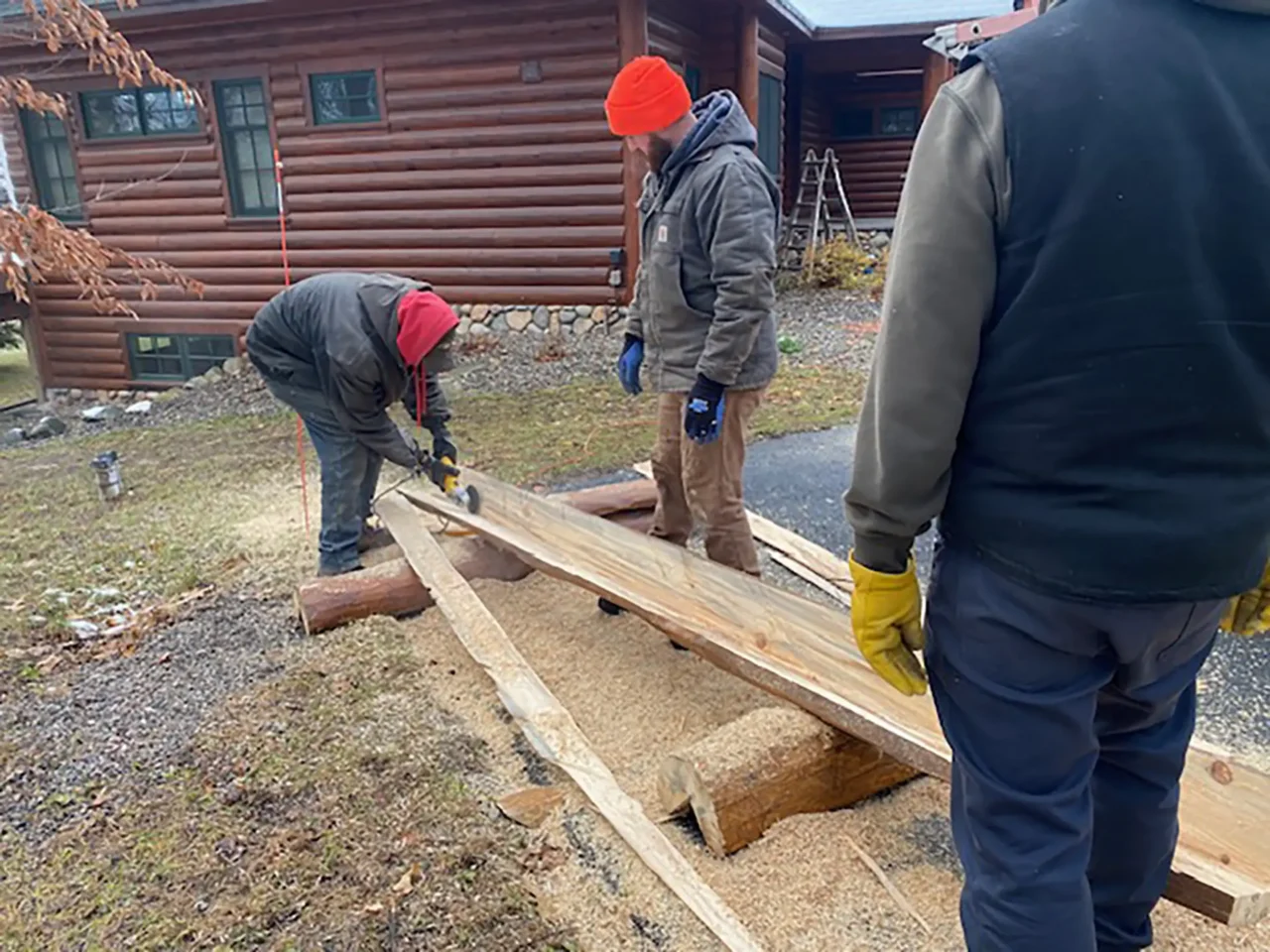 Deck building crew working on a log home structural replacement in crosslake mn